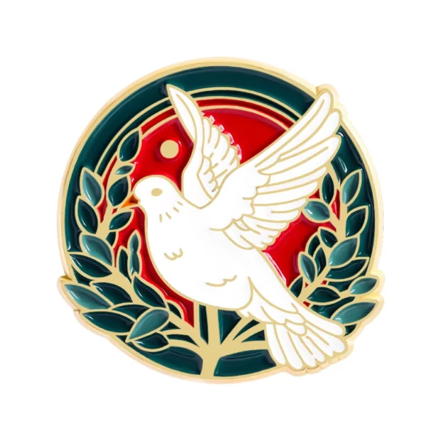 Broche ronde émaillée avec colombe blanche et rameaux verts sur fond rouge